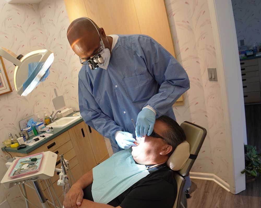 Dentist treating patient at Whittier Palm Dental in Montebello, CA